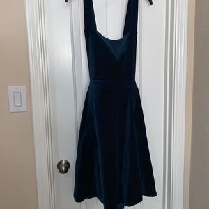 Emerald green velvet bib dress